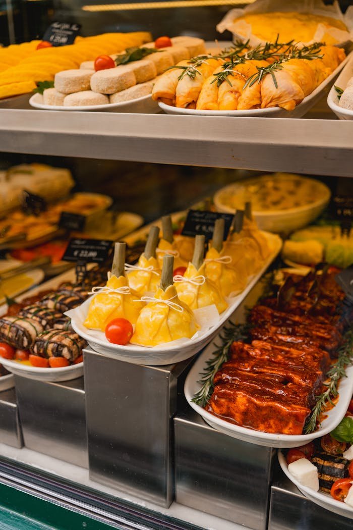 Vibrant array of gourmet Italian food on display in a Rome deli window.